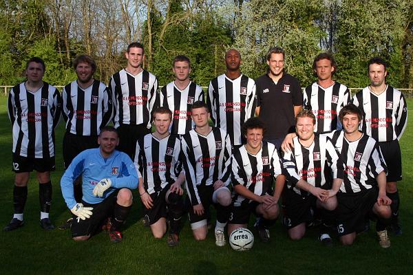 first team April09.jpg - This photo shows the first team before their final match of the season in April 2009. They are:Back row, left to right:Martin McPhee, Chris Cooper, Ben Phipps, Jack Wilding, Viv Greywood, Neil Brewer (Manager), Marco Mills, Stuart CorbyFront row, left to right:Ashley Clarke, Elliott Chevis, Jake Freeman, Daniel Munson, Rob Cooper, Shaun Anderson